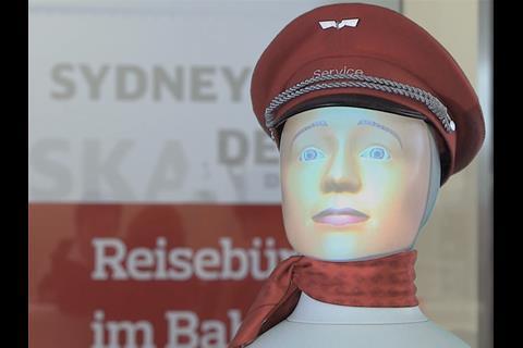 A robot head which talks to passengers is being tested by Deutsche Bahn and Fraport.